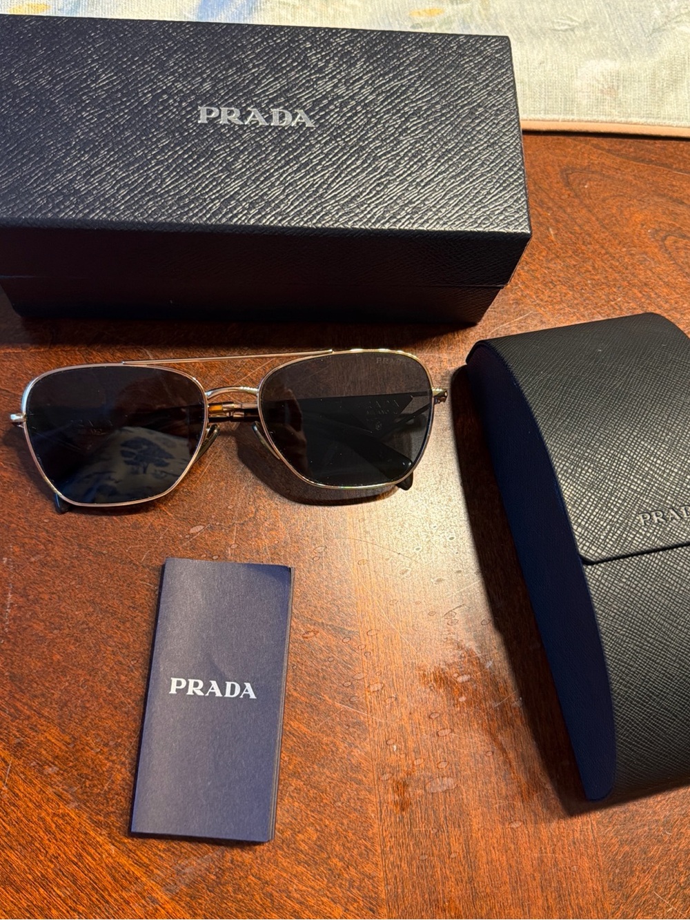 Prada Men’s Black Lens Sunglasses with Gold Frame